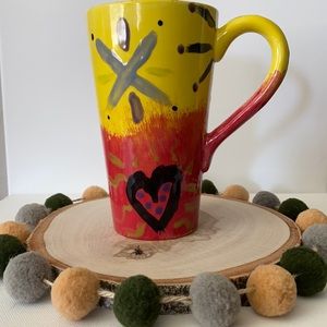 Tall, very cool coffee mug.